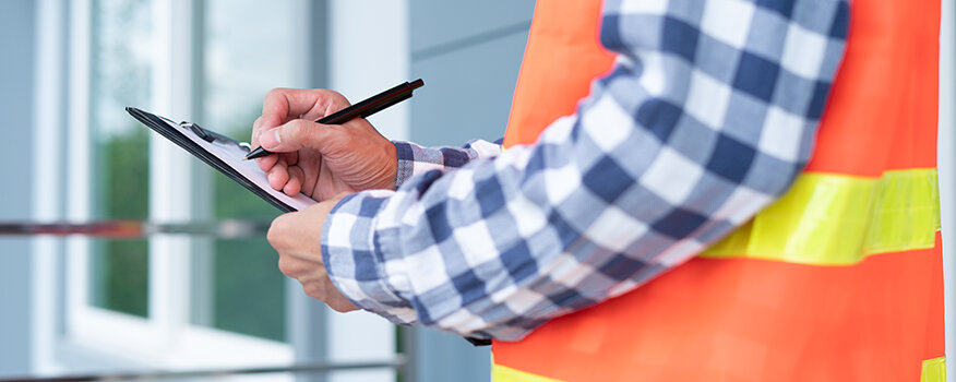 The,Inspector,Or,Engineer,Is,Checking,The,Building,Structure,And Importance of Timely Roof Inspections Kearney, NE