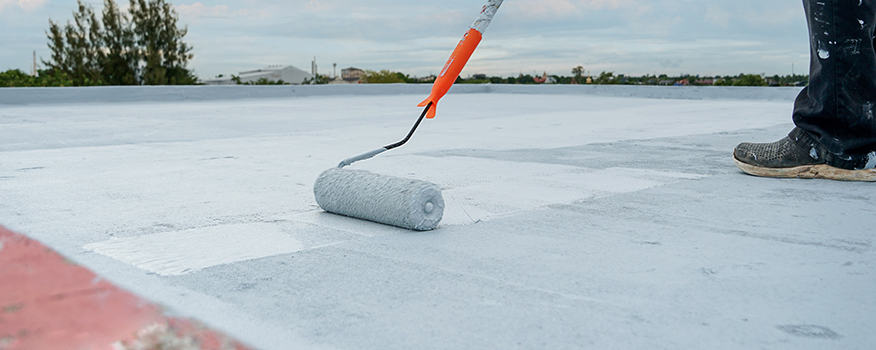 Applying roof coating to help businesses in aurora save on energy costs