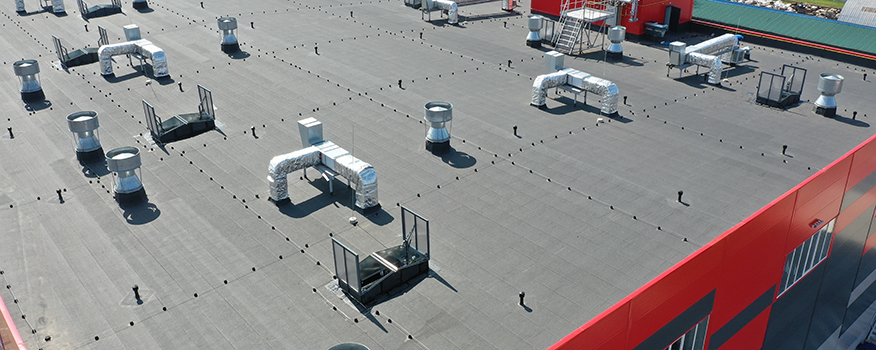 Aging commercial flat roof restored with durable spray foam and elastomeric coatings in Lincoln
