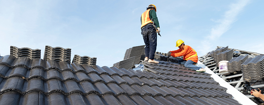 Commercial roofing contractor performing a roof inspection on a commercial building in Omaha