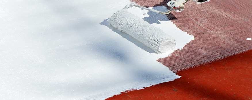 applying roof coating to commercial building in omaha
